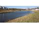 Serene pond surrounded by natural greenery, offering a peaceful and scenic view within the community at 3515 Montebello Pkwy, Cumming, GA 30028
