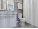 Bathroom featuring a vanity, toilet and shower with modern fixtures and decor at 4870 Odum View Ln, Cumming, GA 30040