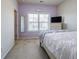 Comfortable bedroom with carpet flooring, and a bed with white bedding, complemented by natural light at 4870 Odum View Ln, Cumming, GA 30040