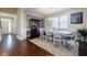 Bright dining room features a chandelier and a large window for ample natural light at 4870 Odum View Ln, Cumming, GA 30040