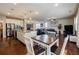Spacious kitchen and living room combo featuring an eat-in area, island and an open layout at 4870 Odum View Ln, Cumming, GA 30040