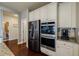 Kitchen features stainless steel appliances and leads to the pantry and other rooms at 4870 Odum View Ln, Cumming, GA 30040