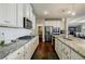Kitchen with granite countertops, stainless steel appliances, and a pantry for storage at 4870 Odum View Ln, Cumming, GA 30040
