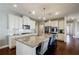 Spacious kitchen with stainless steel appliances, a granite island and eat-in seating at 4870 Odum View Ln, Cumming, GA 30040