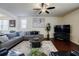 Inviting living room boasts a comfortable gray sofa, modern decor, and natural light at 4870 Odum View Ln, Cumming, GA 30040