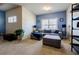 Comfortable upstairs living room with a plush sofa, natural light, and a stylish bookshelf at 4870 Odum View Ln, Cumming, GA 30040