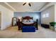 Spacious main bedroom with a large bed, sitting area, and abundant natural light at 4870 Odum View Ln, Cumming, GA 30040