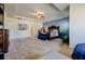 Spacious main bedroom with a stylish ceiling fan, blue accent wall, and large bed at 4870 Odum View Ln, Cumming, GA 30040