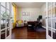 Comfortable office with hardwood flooring, french doors, and ample natural light at 4870 Odum View Ln, Cumming, GA 30040