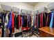 Walk-in closet with clothing racks and built-in shelving for storage at 4870 Odum View Ln, Cumming, GA 30040