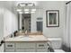 Bathroom with shower curtain, framed art and traditional cabinets at 710 E Northway Ln, Atlanta, GA 30342