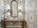 Charming powder room with patterned wallpaper, ornate mirror, and marble sink at 710 E Northway Ln, Atlanta, GA 30342