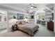 Bedroom with a view, striped walls, and a connecting bathroom at 710 E Northway Ln, Atlanta, GA 30342