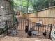 A backyard chicken coop with a black fence and several chickens at 710 E Northway Ln, Atlanta, GA 30342