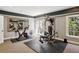 Home gym with exercise equipment, mirrors, and natural light at 710 E Northway Ln, Atlanta, GA 30342
