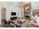 Cozy living room featuring a stone fireplace, built-in bookshelves, and comfortable seating at 710 E Northway Ln, Atlanta, GA 30342