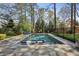 Backyard swimming pool with lounge chairs and lush landscaping at 710 E Northway Ln, Atlanta, GA 30342