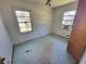 Bedroom with a window AC unit and worn flooring at 103 Woodhaven Dr, Stockbridge, GA 30281
