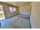 The living room features a window and worn carpeting at 103 Woodhaven Dr, Stockbridge, GA 30281