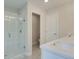 Modern bathroom with walk-in shower, white subway tile, and a sleek white vanity at 1628 Ruskin Way, Marietta, GA 30062