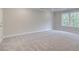 Expansive bedroom featuring a neutral carpet and a sunlit window at 1628 Ruskin Way, Marietta, GA 30062