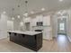 Stylish kitchen with a dark island, white cabinets, and stainless-steel appliances at 1628 Ruskin Way, Marietta, GA 30062