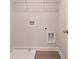 Convenient laundry room featuring hookups and shelving at 1628 Ruskin Way, Marietta, GA 30062