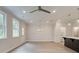 Bright living space with ample natural light and hardwood floors open to kitchen at 1628 Ruskin Way, Marietta, GA 30062
