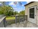 Cozy back porch with railing, providing a relaxing outdoor space with views of the lush backyard at 2601 Semmes St, Atlanta, GA 30344