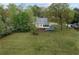 Large backyard featuring a deck, ample green space, and mature trees at 2601 Semmes St, Atlanta, GA 30344
