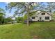 Expansive backyard featuring mature trees, providing a serene and private setting, ideal for relaxation and outdoor activities at 2601 Semmes St, Atlanta, GA 30344