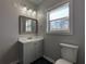 This bathroom has a large vanity, toilet, and modern lighting at 2601 Semmes St, Atlanta, GA 30344