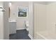This bathroom has a tub with shower, toilet, and vanity at 2601 Semmes St, Atlanta, GA 30344