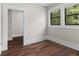This bedroom features hardwood floors, natural light, and an open doorway at 2601 Semmes St, Atlanta, GA 30344