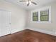 Bright bedroom features hardwood floors, ceiling fan, and double windows at 2601 Semmes St, Atlanta, GA 30344
