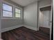 Bedroom has hardwood floors, natural light from the windows, and a doorway at 2601 Semmes St, Atlanta, GA 30344