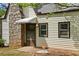 Close-up view of the front entrance and stone chimney at 2601 Semmes St, Atlanta, GA 30344