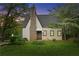 Quaint house with stone chimney, siding, and well-manicured lawn at 2601 Semmes St, Atlanta, GA 30344
