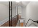 Hallway with hardwood floors and a wrought iron railing at 2601 Semmes St, Atlanta, GA 30344