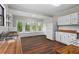 Kitchen with bright windows, white cabinetry, wood countertops, and stainless steel appliances at 2601 Semmes St, Atlanta, GA 30344