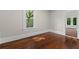 Bright living room featuring hardwood floors and a large window offering a pleasant outdoor view at 2601 Semmes St, Atlanta, GA 30344