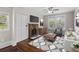 Cozy living room with fireplace, hardwood floors, and ample natural light at 2601 Semmes St, Atlanta, GA 30344