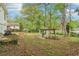 View of the large backyard with mature trees and gazebo offering a private and serene outdoor space at 353 Oak Ridge Se Dr, Marietta, GA 30060