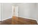 Bedroom featuring hardwood floors, white trim, baseboards, and a view into another room at 353 Oak Ridge Se Dr, Marietta, GA 30060
