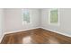 Bedroom featuring hardwood floors, bright windows, white trim and baseboards at 353 Oak Ridge Se Dr, Marietta, GA 30060