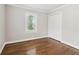 Bedroom showcasing hardwood floors, a closet, a bright window, and white trim at 353 Oak Ridge Se Dr, Marietta, GA 30060