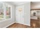 Bright entryway with hardwood floors, a front door with glass, and view into kitchen at 353 Oak Ridge Se Dr, Marietta, GA 30060