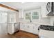 Bright kitchen with modern appliances, white cabinets, and hardwood floors at 353 Oak Ridge Se Dr, Marietta, GA 30060