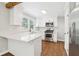 Updated kitchen with white cabinets, stainless steel appliances, and quartz countertops at 353 Oak Ridge Se Dr, Marietta, GA 30060