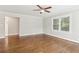 Bright living room featuring hardwood floors, neutral paint, white trim, and an updated ceiling fan at 353 Oak Ridge Se Dr, Marietta, GA 30060